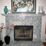 This fireplace is fabricated of Serizzo granite. The mantle and hearth are laminated