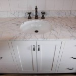 This white carrara marble vanity is located in the same bath as the above white carrara marble shower